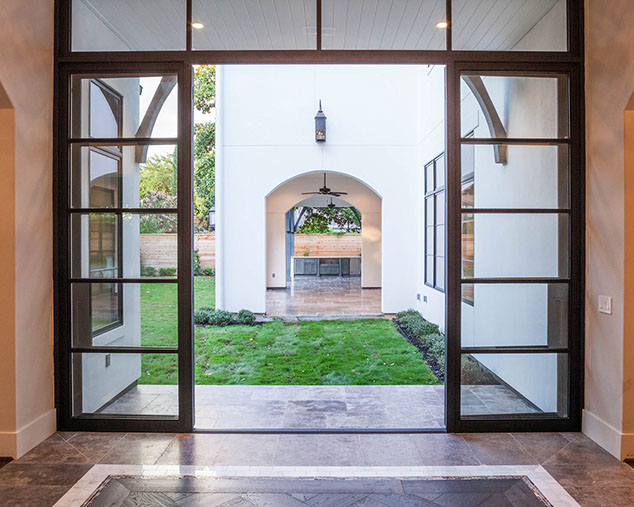 Foyer with glass and metal custom wall