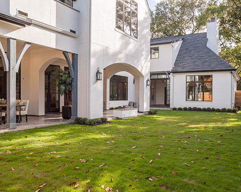 Spacious yard with outdoor living and modern fire feature