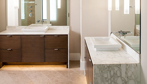 Floating modern master bath vanities with toe kick lighting