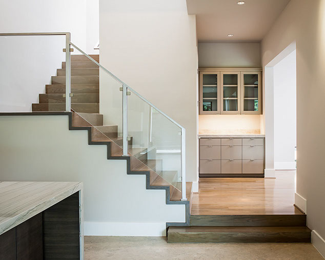 modern stair with glass rail and butler pantry