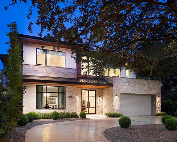 Contemporary prairie style inspired exterior with stone stucco and metal roof