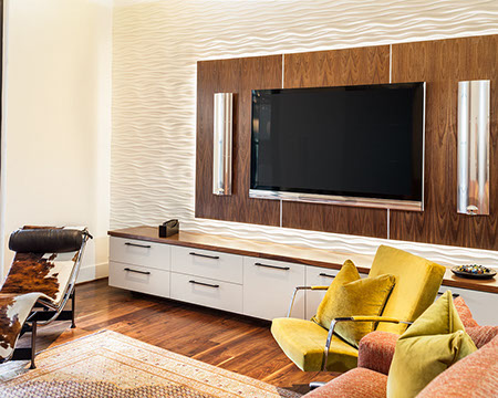 Contemporary media room with wood wall panel and textured tile. Bang and Olufsen equipment