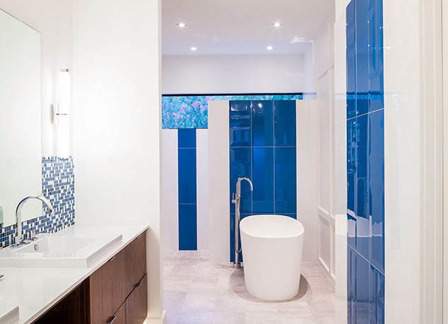 Modern master bath with freestanding soaker tub and large walk in shower