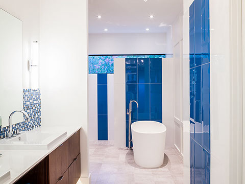 Modern master bath with freestanding soaker tub and large walk in shower